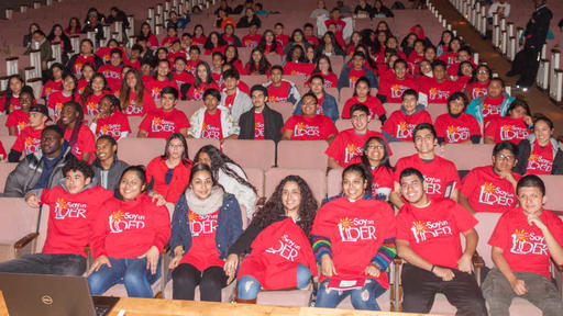 Soy Un Lider attendees wearing red shirts take a big group photo in Dana Auditorium.