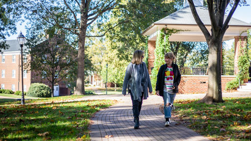 Biology Professor Michele Malotky and Caroline Sprenger '22 walk across the Quad.