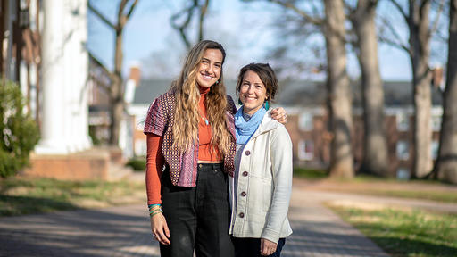 Mallory Cerkleski and Professor Bronwyn Tucker take a photo together on campus.