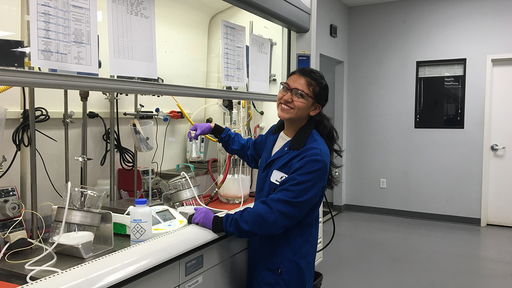 Student Emi Moscoso in a lab while on the Research and Development team at Ennis Flint.