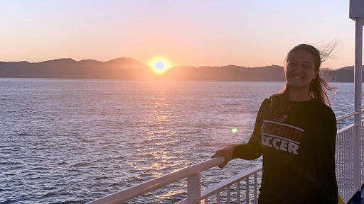 Guilford College student Sonya Brunk '21 stands by the ocean in New Zealand.